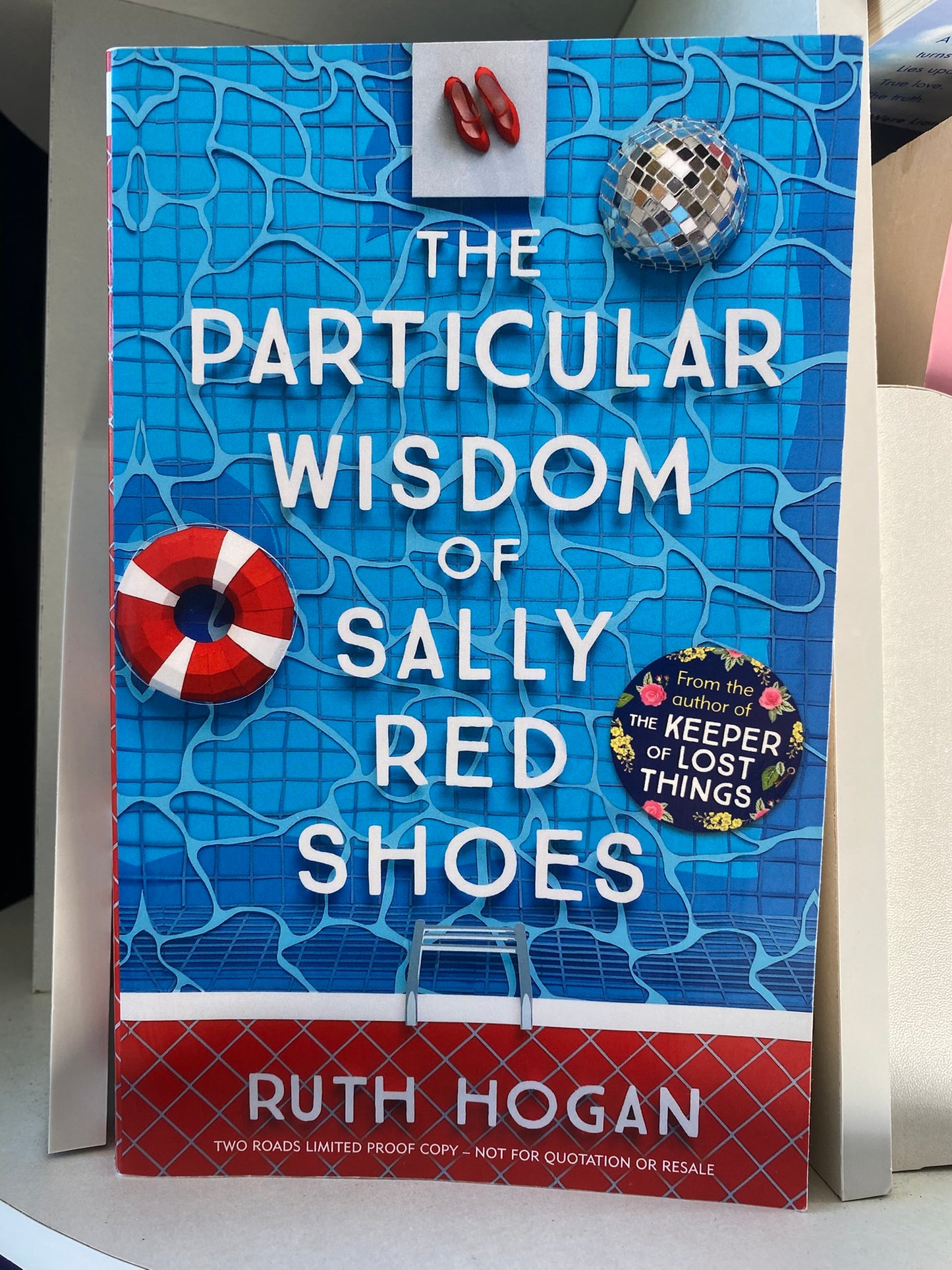 The Particular Wisdom of Sally Red Shoes by Ruth Hogan